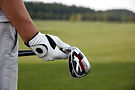 Holding Golf Clubs