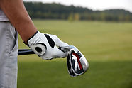 Holding Golf Clubs