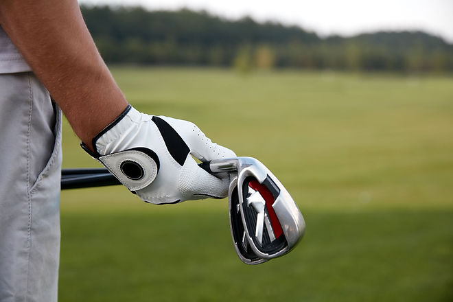 Holding Golf Clubs