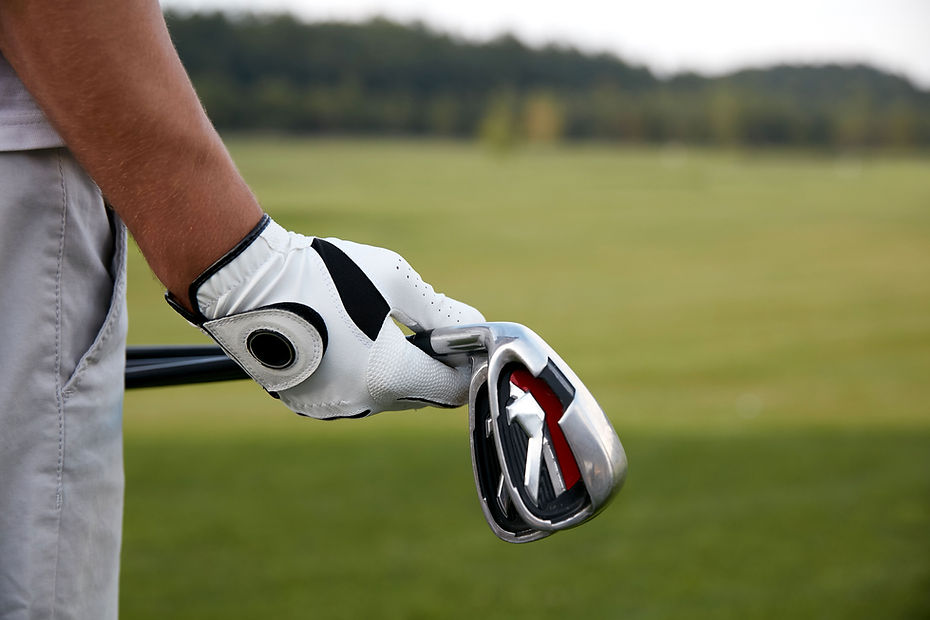 Holding Golf Clubs