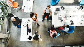 Team collaboration in an office setting, Project managers supporting team cohesion