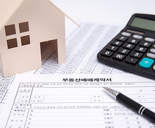 Real Estate Contract with Pen and Calculator