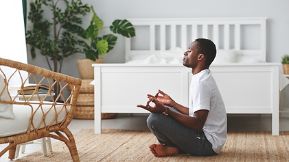 Man Meditating Indoors