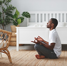 Man Meditating Indoors