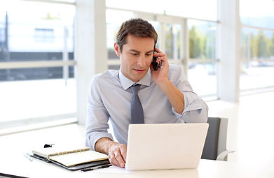 Man Making Phone Call in Office