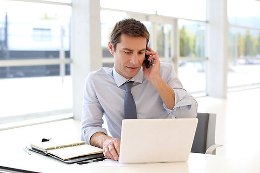 Man Making Phone Call in Office