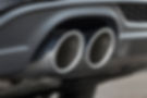 Close-up shot of a luxury car's double pipe exhaust system