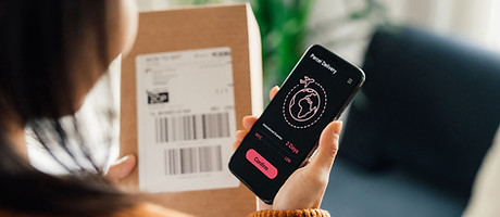 Woman confirming her delivery on smartphone