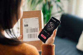 Woman confirming her delivery on smartphone