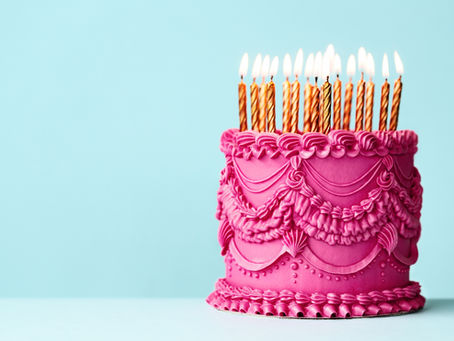 A birthday cake with lit candles