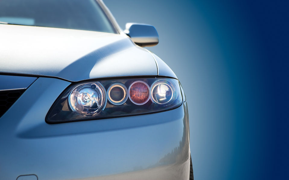 Shiny silver car with headlights
