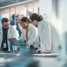 Scientists Collaborating in Laboratory