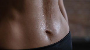 Spray Tanning Abs in Austin