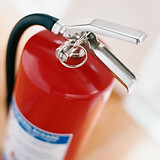 Fire extinguisher, focus on the handle