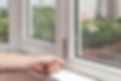 close-up image of a person's hand while repairing windows
