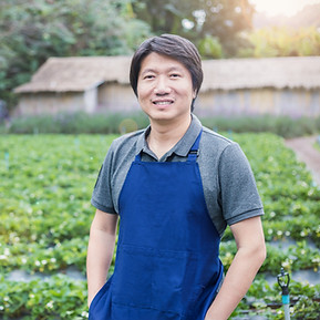 Person in Apron Standing in the Farm