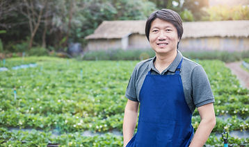 Person in Apron Standing in the Farm