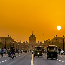 India’s Mega Projects Driving the Future India, the world’s fifth-largest economy, is undergoing one of the most ambitious infrastructure transformations in modern history. From record-breaking renewable energy parks to state-of-the-art expressways, industrial corridors, and bullet trains, the country is creating an economic backbone to support its vision of becoming a developed nation under Mission 2047 . These India mega projects  are not simply about building roads, bridges, or power plants. They are large-scale, integrated developments designed to cut logistics costs, boost urbanisation, attract manufacturing, and meet climate goals. For global investors, they present a front-row seat to one of the fastest-growing infrastructure markets in the world. Here are the top 10 mega projects in India  shaping its economic and social future in 2025. 1. NICDC Industrial Corridors and Smart Cities The National Industrial Corridor Development Corporation (NICDC)  is building a network of industrial corridors and next-generation smart cities across India. Covering over 32 development nodes in 11 corridors, these projects provide world-class manufacturing infrastructure, seamless logistics, and robust connectivity. Over ₹28,600 crore has been allocated to 12 flagship smart city projects under NICDC. These cities will act as economic engines—creating jobs, supporting micro, small and medium enterprises (MSMEs), and enabling high-value production. For investors, these corridors are magnets for technology transfer, manufacturing partnerships, and long-term industrial growth. 2. PM Gati Shakti National Master Plan Launched in 2021, the PM Gati Shakti National Master Plan  brings together 44 central ministries, 36 states and union territories, and data from more than 1,650 sources onto a single digital platform. Its goal is to deliver faster, more efficient infrastructure development by improving coordination and reducing project delays. By integrating road, rail, port, and utility planning, Gati Shakti  creates a seamless multi-modal transport network. The plan also aims to cut India’s logistics costs from 14–16% of GDP to under 9%, making Indian goods more competitive globally and attracting foreign investment into manufacturing and trade hubs. 3. Bharatmala Pariyojana Project The Bharatmala Pariyojana  is India’s largest road development programme, targeting over 34,800 km of national highways. Phase I alone has already delivered nearly 20,000 km, with total investment reaching ₹4.72 lakh crore. The project not only strengthens domestic connectivity but also builds border roads linking India to Nepal, Bhutan, Bangladesh, and Myanmar—boosting trade and regional cooperation. Direct and indirect job creation from the programme is expected to run into tens of millions over its lifespan. 4. Digital Highways Initiative India is combining transport and telecom infrastructure with its Digital Highways Initiative . The National Highways Authority of India (NHAI)  is laying 10,000 km of optical fibre cable along national highways to expand internet access in rural areas and enable technologies like 5G, connected vehicles, and real-time traffic systems. Pilot projects are already running along the Delhi-Mumbai Expressway and Hyderabad-Bengaluru corridor, paving the way for a digitally connected logistics and transport system nationwide. 5. Western Dedicated Freight Corridor (WDFC) The Western Dedicated Freight Corridor  is a freight-only railway line running 1,506 km from Dadri in Uttar Pradesh to Jawaharlal Nehru Port in Maharashtra. Its purpose: free up passenger rail lines and create a high-speed, high-capacity route for goods movement. With over 96% of the corridor operational as of mid-2025, travel times for freight have been cut dramatically, reducing logistics costs by up to 15% and boosting industrial efficiency. 6. Delhi–Mumbai Expressway The Delhi–Mumbai Expressway —an eight-lane, 1,386 km highway—will halve travel time between India’s political capital and its financial hub. Due for completion in October 2025, it is set to transform logistics, tourism, and trade along its route. This greenfield expressway connects Delhi, Haryana, Rajasthan, Madhya Pradesh, Gujarat, and Maharashtra, opening up new growth corridors for manufacturing, agriculture, and services. 7. Major Airport Developments – Noida and Navi Mumbai India’s aviation boom is supported by two landmark projects: the Noida International Airport  and the Navi Mumbai International Airport . Together, they will ease congestion in existing hubs and prepare India to handle soaring air traffic demand. The Noida airport is on track for operations in 2025, while Navi Mumbai will begin commercial services in August 2025. Both will be vital for tourism, cargo, and regional economic growth. 8. Khavda Renewable Energy Park In Gujarat’s desert region, the Khavda Renewable Energy Park  is becoming the world’s largest solar power installation, covering 72,600 hectares. Expected to be operational by the end of 2025, it will generate nearly 473 million units of clean electricity annually. This mega project cements India’s role as a global leader in renewable energy, aligning with its climate commitments and reducing reliance on fossil fuels. 9. High-Speed Rail – Mumbai to Ahmedabad India’s first high-speed rail project —a 508 km bullet train corridor between Mumbai and Ahmedabad—is under construction with Japanese collaboration. Trains will reach speeds of 320 km/h, slashing travel times and modernising the nation’s rail infrastructure. With over ₹1.08 lakh crore invested, the project is a model for future high-speed lines across India, including planned corridors linking Delhi, Varanasi, and Kolkata. 10. Vadhavan Port Project The Vadhavan Port  in Maharashtra is a deep-water harbour designed to handle the largest container vessels in the world. With a ₹76,200 crore budget and 20-metre-plus depth, it will strengthen India’s position in global shipping. By 2030, the port is expected to manage over 23 million TEUs annually, linking seamlessly with freight corridors, expressways, and other logistics networks under the Gati Shakti framework. India’s Mega Projects: A Platform for Growth India’s top 10 mega projects  showcase a bold, forward-looking vision. They are not only building infrastructure but also creating long-term value by boosting trade, cutting logistics costs, improving connectivity, and promoting sustainable development. For investors, these projects offer access to high-growth sectors with the backing of strong government policy and public-private collaboration. For citizens, they promise jobs, better services, and a more connected, prosperous future. Key recommendations : Invest early  in sectors linked to logistics, renewable energy, and smart cities. Track Gati Shakti projects  for opportunities in multi-modal transport and industrial zones. Monitor renewable and digital infrastructure  as India accelerates its clean energy and digital economy goals. #India #Indianinvestment To stay informed on the latest insights into global infrastructure, investment opportunities, and policy trends, subscribe to George James Consulting’s article at:  www.Georgejamesconsulting.com .