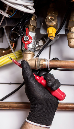 Safeflame plumber installing and repairing domestic pipework in Caernarfon, North Wales.