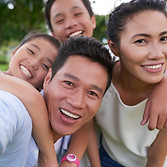 Two adults and two children taking a selfie