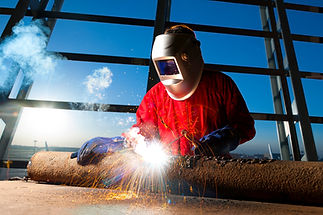 Welder working with sparks flying