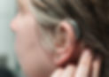 Close-up of a hearing aid on the woman's ear