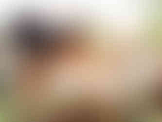 Two brides embracing on wedding day