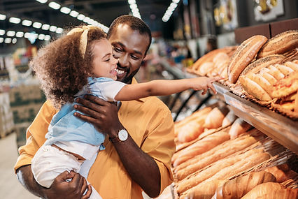 Father and daughter buying groceries