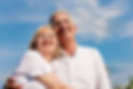 Happy mature couple - senior people (man and woman) already retired - looking to the blue