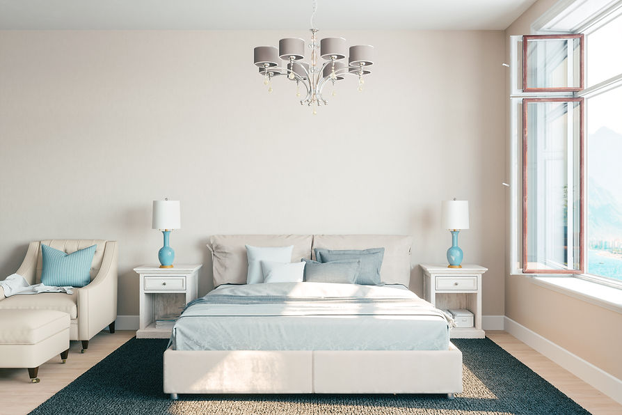 A serene bedroom with a beige bed, light blue bedding