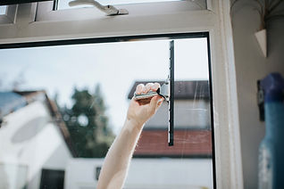 Window cleaning with a squeegee on exterior glass
