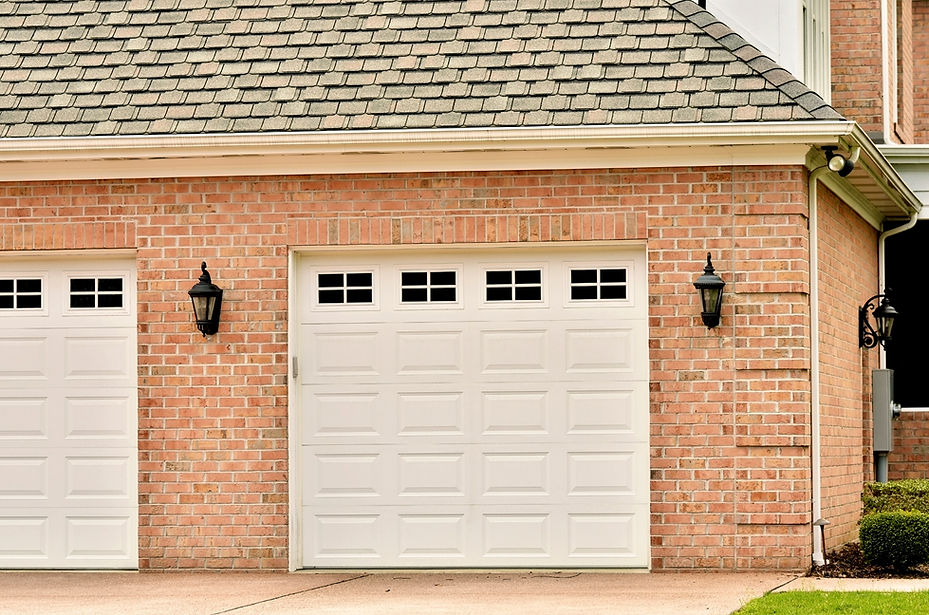 Double garage with white doors