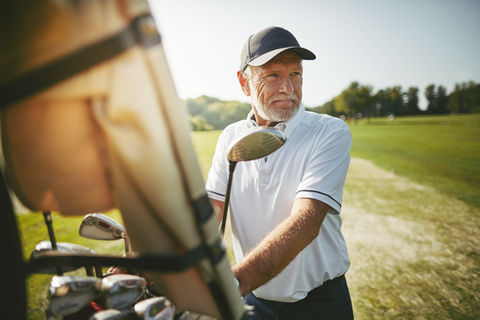 Golfer with a golf cart
