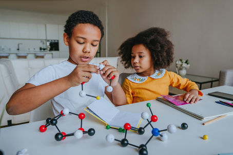 Kids making molecular models at home