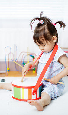 Toddler Playing Drums