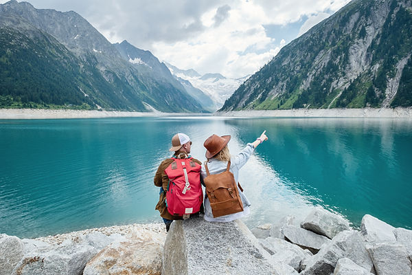 Young people at the mountain lake