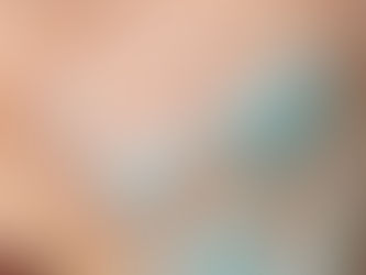 Close-up of glowing, healthy skin texture with Environ Skin EssentiA Mild Cleansing Lotion on a luxury marble surface, reflecting gold tones and clinical skincare branding.