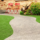 Walk way with perfect grass landscaping with artificial grass in residential area