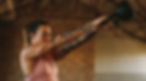 Woman doing dumbbell swing