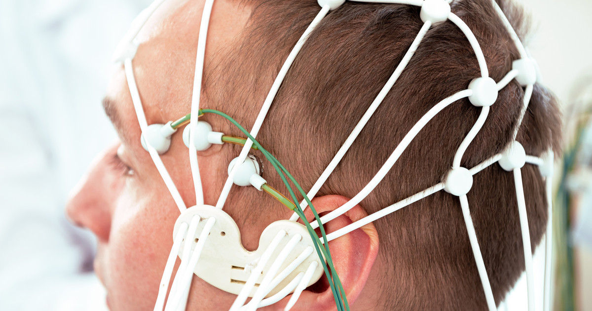 A person participating in a biofeedback session while monitoring breathing and muscle tension to improve nervous system regulation.