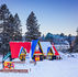 Colorful Christmas village houses covered in snow and gorgeous vistas.