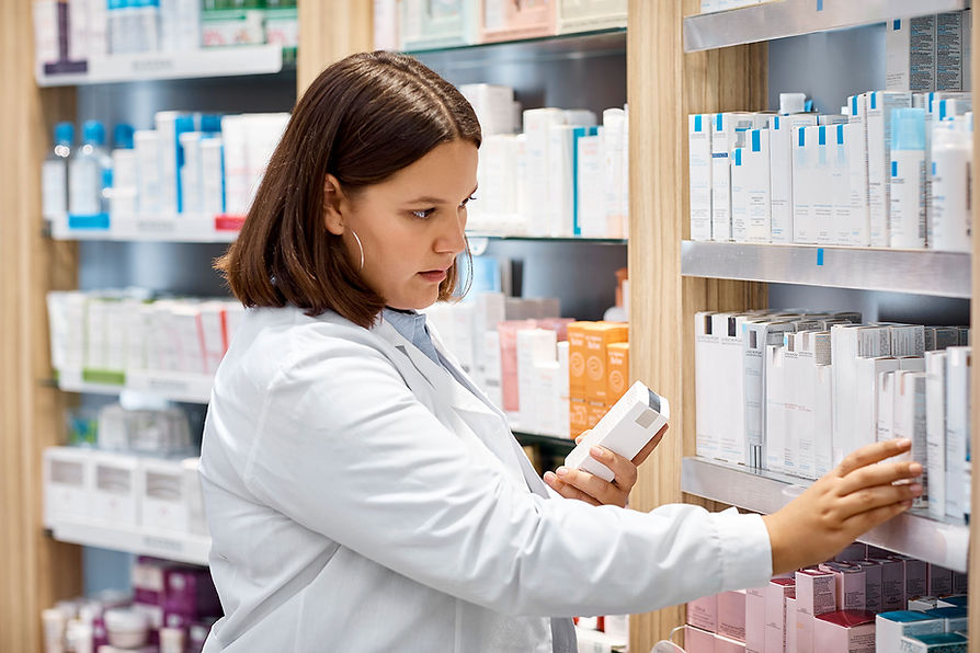 Woman reviewing products in pharmacy