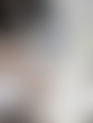 A team meeting with a laptop in the background