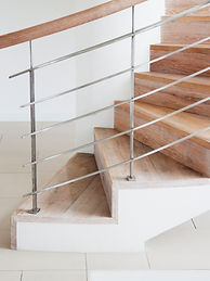 Wooden staircase and railing in modern house