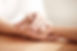 Close up of hands holding to show supportive and compassionate care