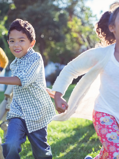 Children running in field