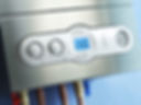The control panel of a modern boiler with digital display and knobs