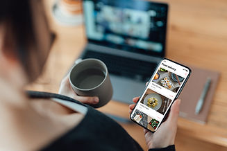 A person holds a smartphone showing a food delivery app