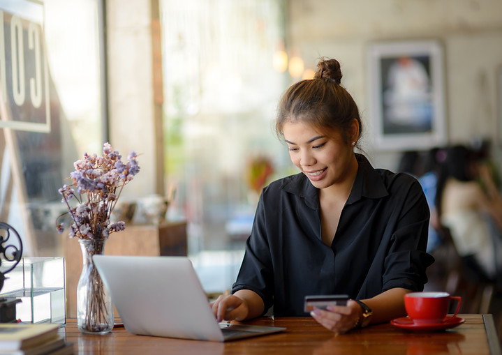 A woman make payment online using credit card