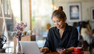 A woman make payment online using credit card